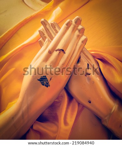 Vintage retro effect filtered hipster style travel image of Buddha statue hands in Vajrapradama Mudra (Mudra of Unshakable Self Confidence). Wat Phra That Doi Suthep, Chiang Mai, Thailand