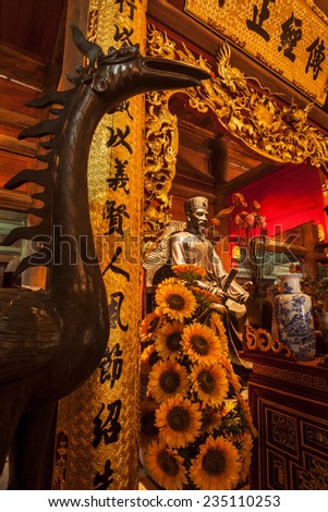 HANOI, VIETNAM - JUNE 11, 2011: Confucius statue at the Temple of Literature. This temple is dedicated to Confucius, sages and scholars