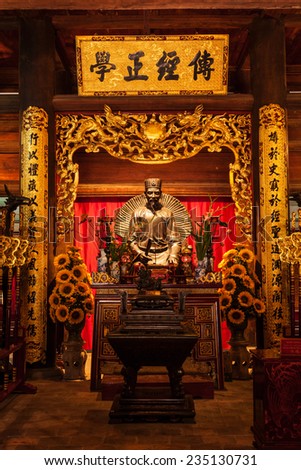 HANOI, VIETNAM - JUNE 11, 2011: Confucius statue at the Temple of Literature. This temple is dedicated to Confucius, sages and scholars