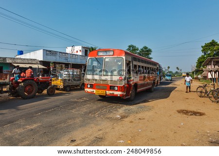 KANCHIPURAM, INDIA - September 12, 2009: Public bus in rural street. Buses take up 90% of public transport in Indian cities, serve as cheap and convenient mode of transport for all classes of society