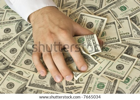 Greedy hand grabs money lot of dollars