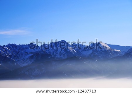 Remote mountains (The Tatras in Poland) above clouds