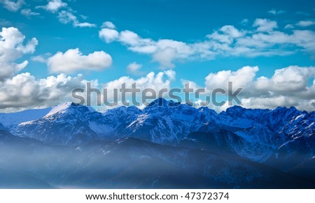 Remote mountains (The Tatras in Poland) above clouds