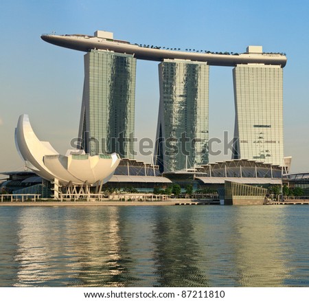 SINGAPORE - MAY 6: The Marina Bay Sands complex on sunset on May 6, 2011 in Singapore. Marina Bay Sands is an integrated resort and billed as the world\'s most expensive standalone casino property