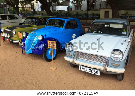 CHENNAI - INDIA - JULY 24: Fiat 500 and Triumph Herald 1966 (retro vintage cars) on Heritage Car Rally 2011 of Madras Heritage Motoring Club at Egmore on July 24, 2011 in Chennai, India