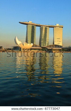 SINGAPORE - MAY 6: The Marina Bay Sands complex on sunset on May 6, 2011 in Singapore. Marina Bay Sands is an integrated resort and billed as the world\'s most expensive standalone casino property