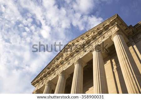 Historic building in Washington DC over bright blue sky. Place for copy