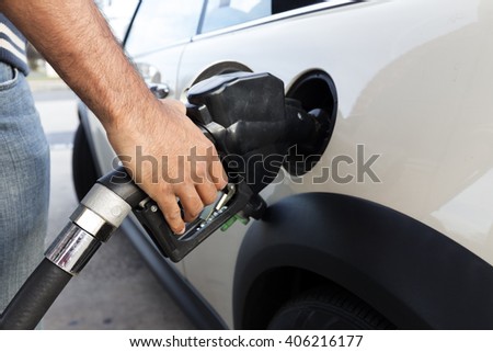 Filling gas at the station. Fill the gas tank. Self service. Gas pump in the car. Refill oil, gasoline, diesel vehicle