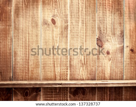 Empty shelf on wooden background. Wood texture.