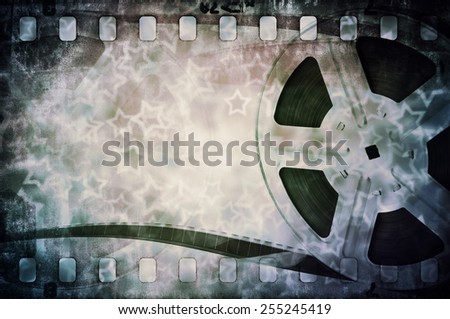 Motion picture film reel with strip and stars background
