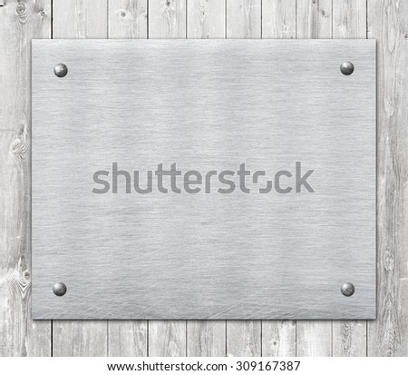 Composition of metal aluminum plaque, name plate on wooden wall planks