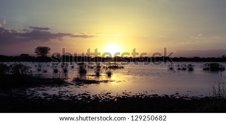 A sunset over a lake in Manyara Ranch Conservancy. Tanzania