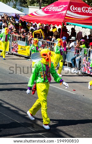 Barranquilla, Colombia - March 1, 2014 - Performers in elaborate costume sing, dance, and stroll their way down the streets of Barranquilla during the Battalla de Flores, Carnaval de Barranquilla.