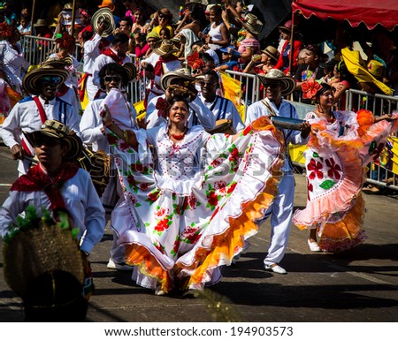 Barranquilla, Colombia - March 1, 2014 - Performers in elaborate costume sing, dance, and stroll their way down the streets of Barranquilla during the Battalla de Flores, Carnaval de Barranquilla.