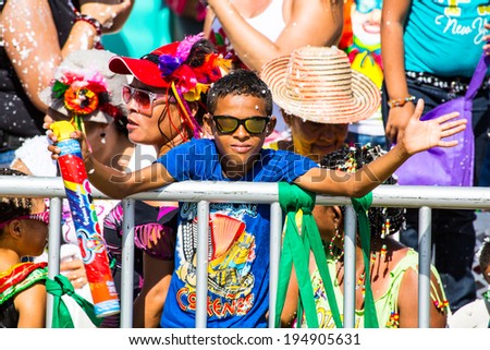Barranquilla, Colombia - March 1, 2014 - Spectators watch the Battalia de Flores parade during the Carnival de Barranquilla.