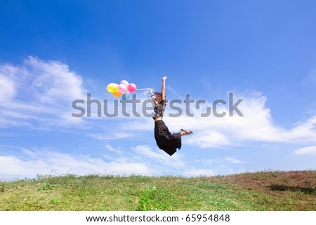 girl jumps from balloons