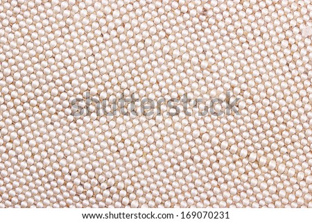 Closeup beige cloth surface texture for background