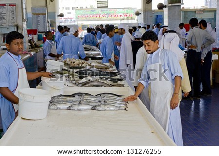 FUJAIRAH, UNITED ARAB EMIRATES - APRIL 15: fishmongers preparing to sell fresh fish and finished fishing, fish market in Fujairah on April 15, 2010 in Fujairah, United Arab Emirates.
