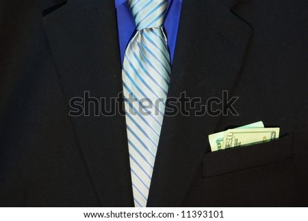 Black suit with blue shirt and tie and money in the pocket.