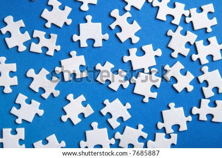 lost puzzle pieces on blue background