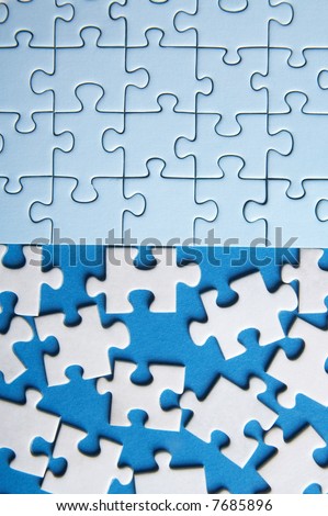 some connected puzzle pieces and some lost pieces on blue background