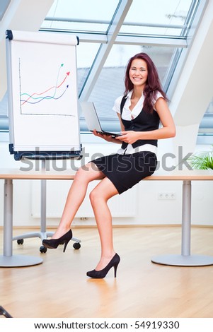 female clerk sitting on desk in office