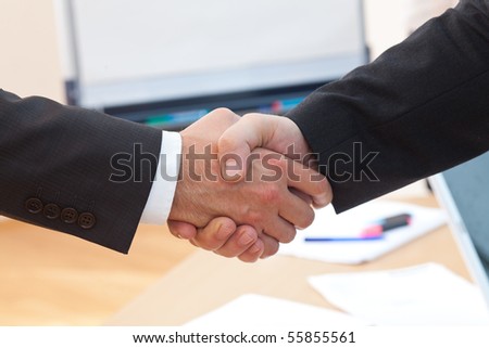 the new client is shaking the bosses hand