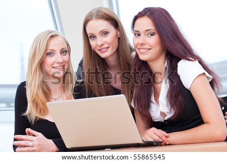 three girls chatting with some friends via Internet