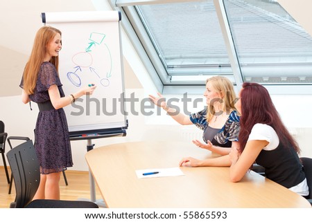 woman is explaining something to her new clients