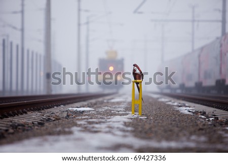 Express train on a branch line on a cold and foggy day