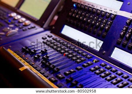 mixing desk with regulators, lamps, lights and different keys