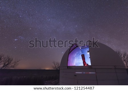 A telescope sits in an open observatory dome at the 3RF Astronomy Campus near Crowell, Texas.