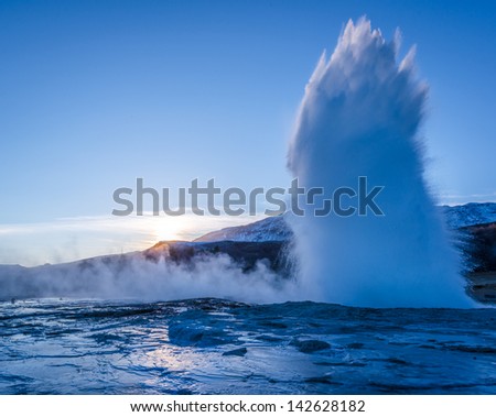 An erupting geyser at the Geysir national park in Iceland.