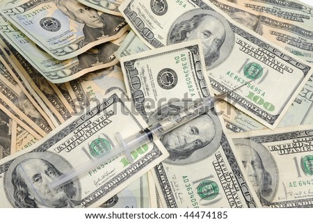 Syringe with money inside on money background