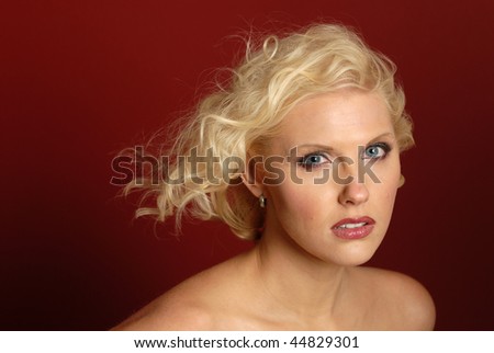 Beautiful blonde woman with hair blowing