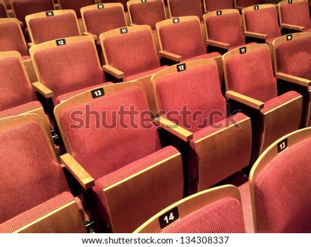 A few rows of empty theater seats