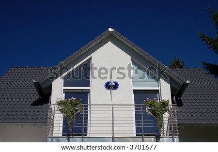 dormer of a roof with balcony