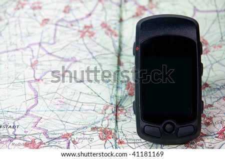 handheld gps on a route map