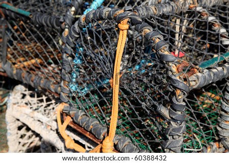 A pile of fisherman\'s lobster pots on the quay