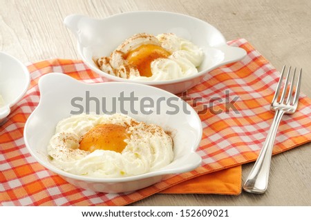 peaches in syrup and whipped cream as dessert