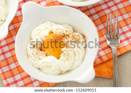 peaches in syrup and whipped cream as dessert