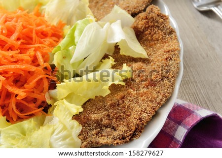 cutlet with salad and chopped carrots