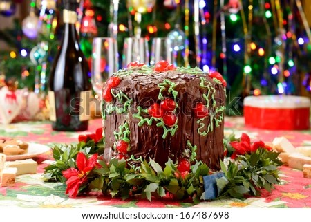Chocolate italian panettone Christmas dessert with lights background