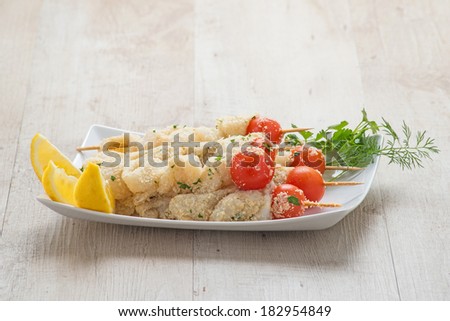 cuttlefish and squid skewers with tomato