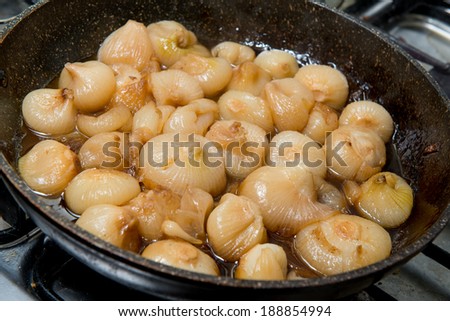 onions cooked in a pan on the stove
