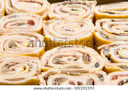 slices of filled pasta in a baking dish