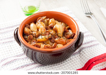stewed onions in a terracotta bowl