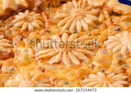 pie decorated with pastry in the shape of flowers