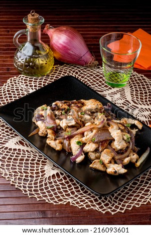 plate of turkey meat with red onions