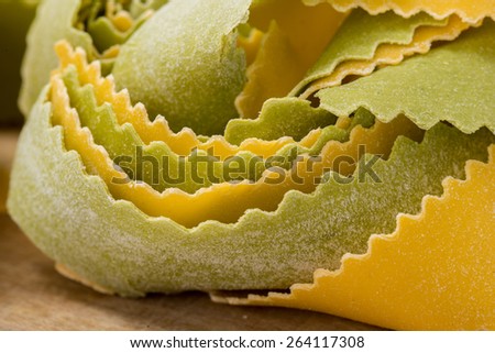 Italian colored pasta raw straw and hay isolated on a white background